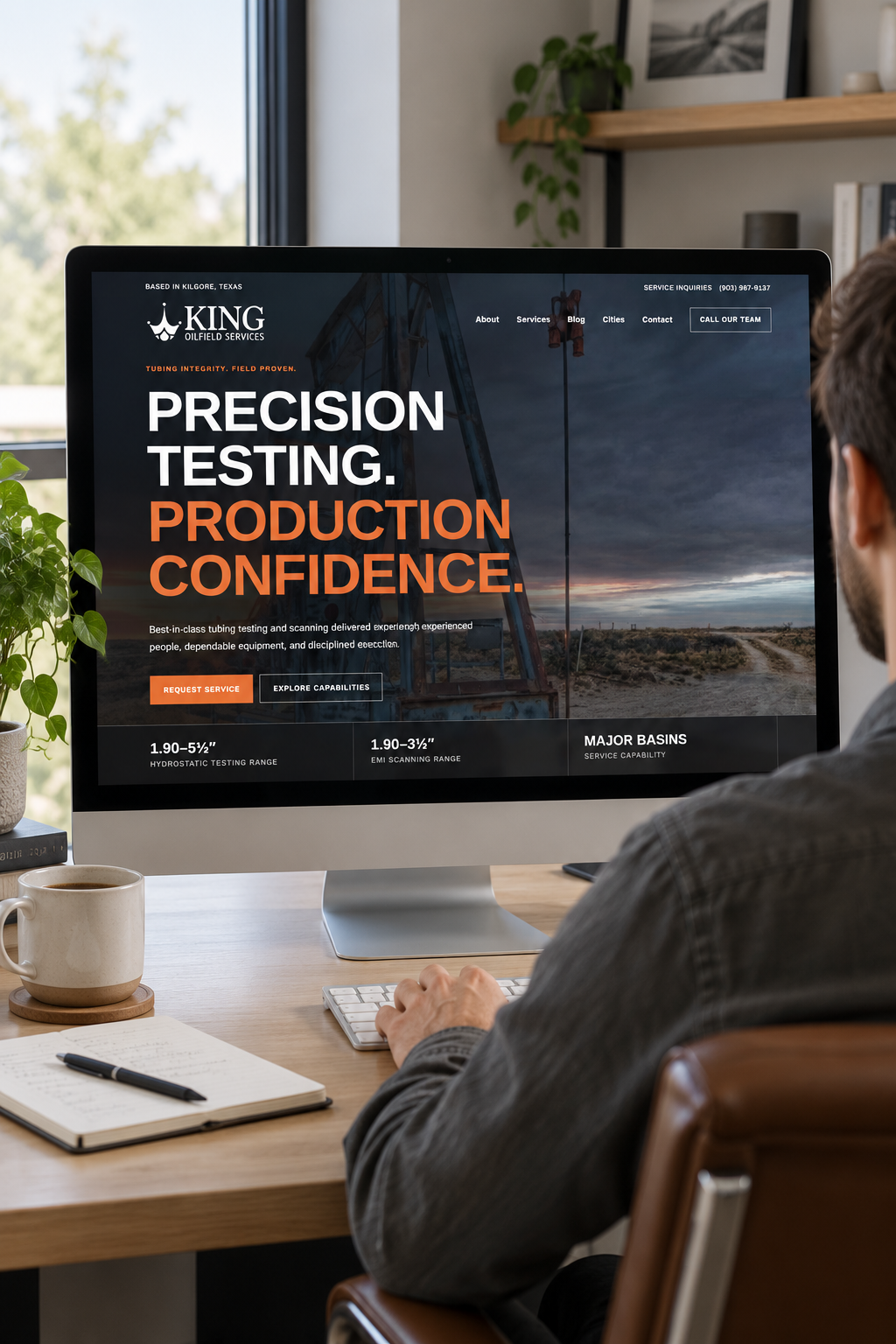 King Oilfield Services website viewed on a desktop monitor in a real workspace