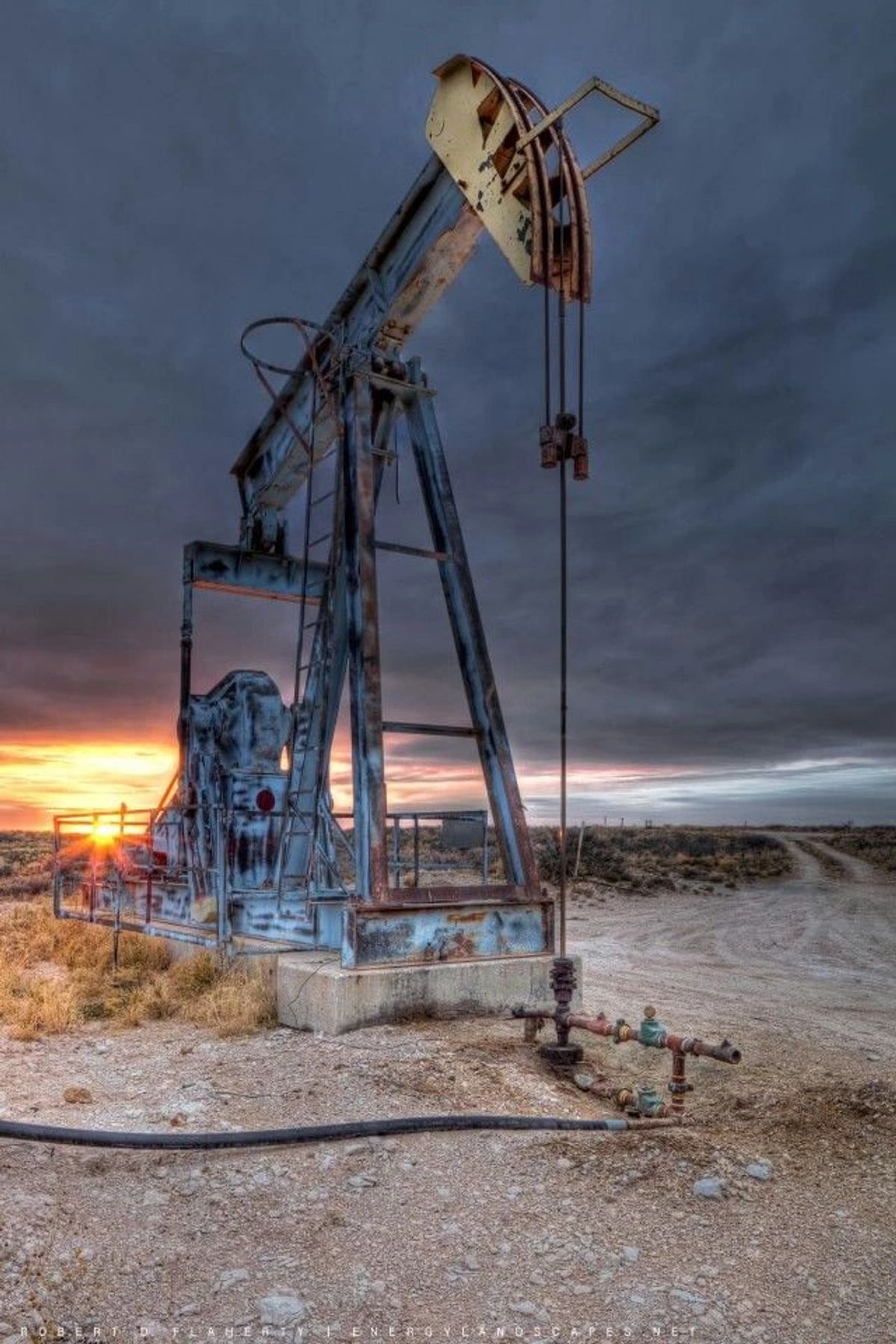 Oilfield pumpjack at dusk