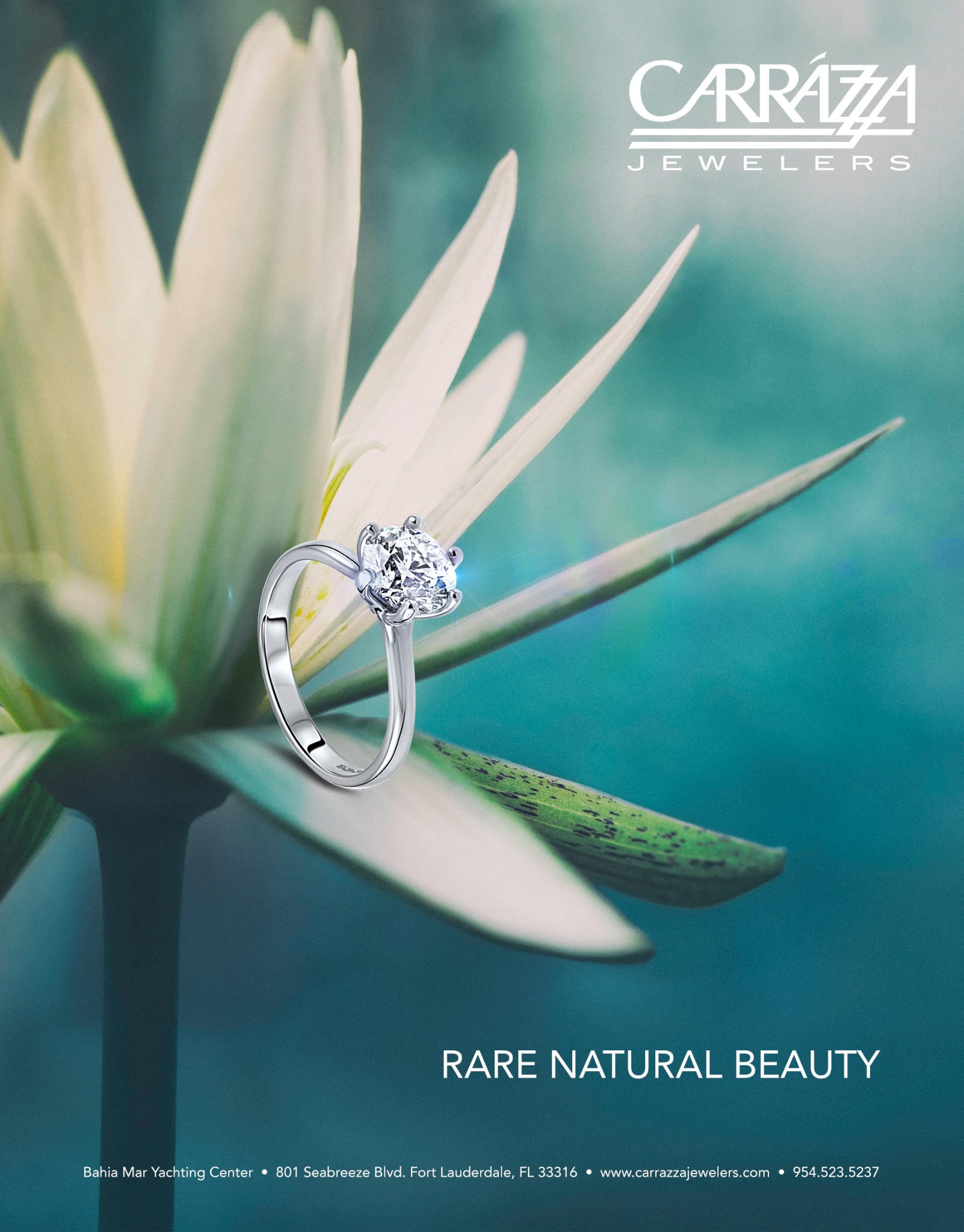 Carrazza Jewelers campaign ad featuring a ring on a pale flower